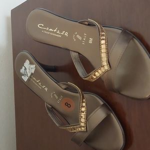Bronze jeweled sandals with heel.